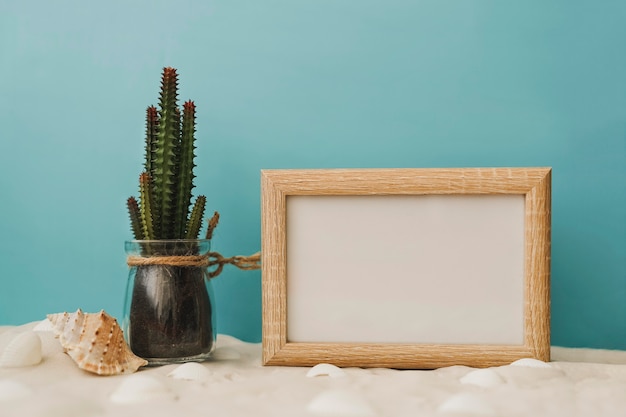 Free Photo cactus and white chalkboard