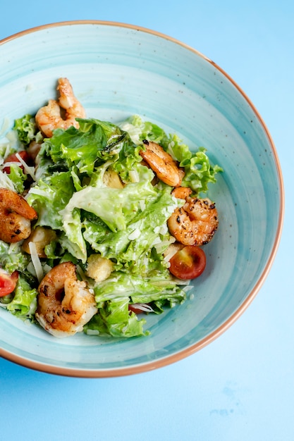 Caesar salad with fried shrimps