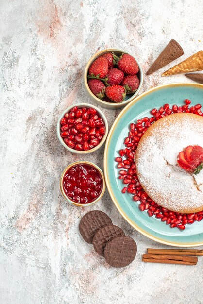 the cake cinnamon strawberries jam in bowl chocolate cookies and the cake