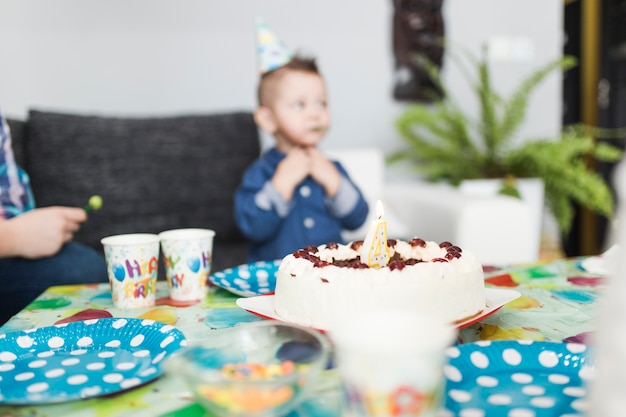 Cake near blurred boy