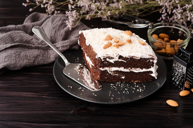 Cake on plate with almonds and flowers