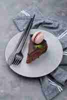 Free photo cake on plate with mint and cutlery