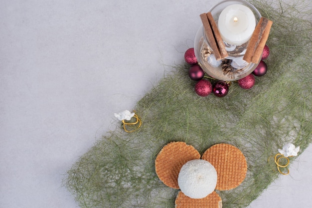 Cake with coconut sprinkles on green surface