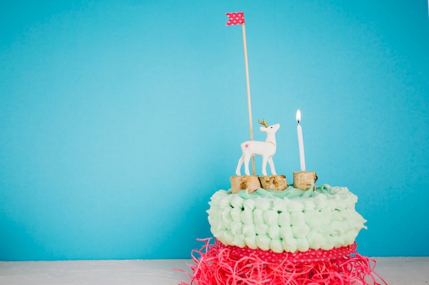 Free photo cake with deer flag and candle