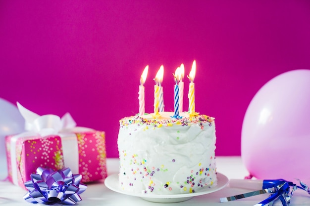 Cake with present and balloons