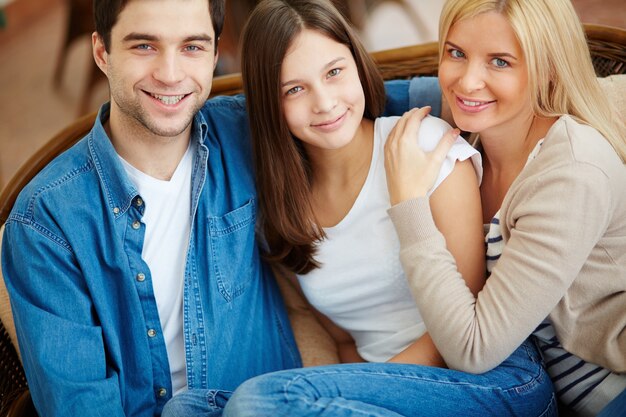 Calm family resting on the couch