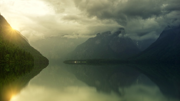 Free photo calm lake under white clouds