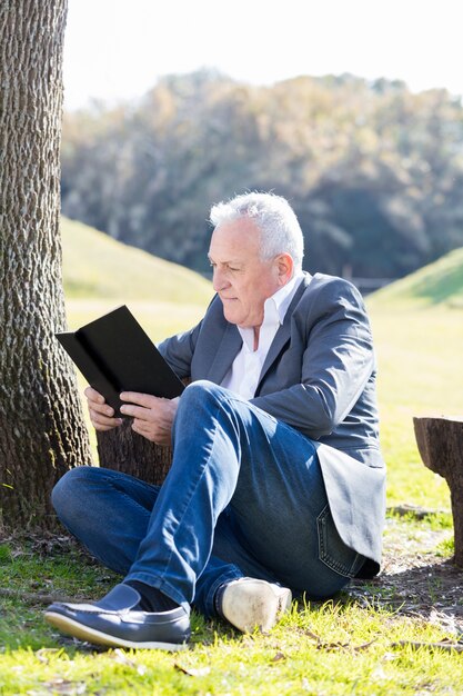 Calm man having a good time with a book