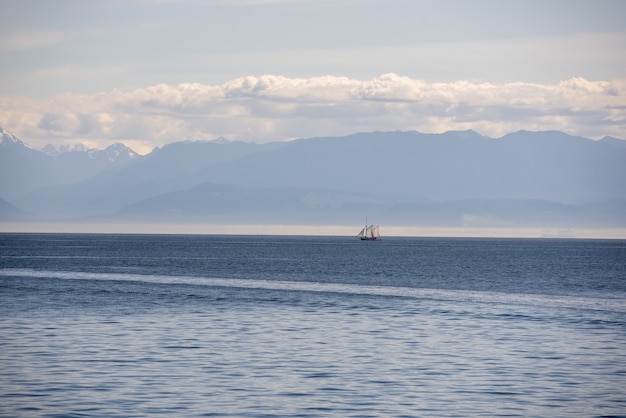 Calm sea with a clear horizon captured on a cloudy day