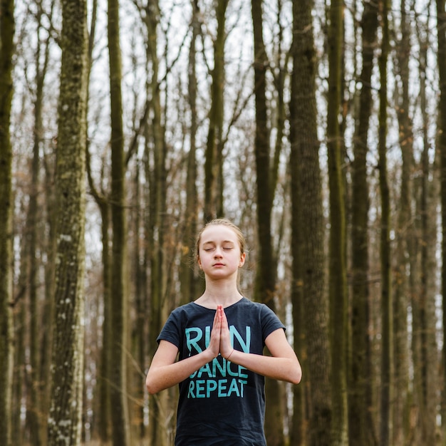 Free photo calm teenager doing yoga