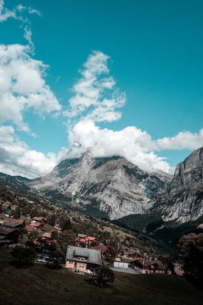 Free Photo a calm village and house next to jungfrau mountains