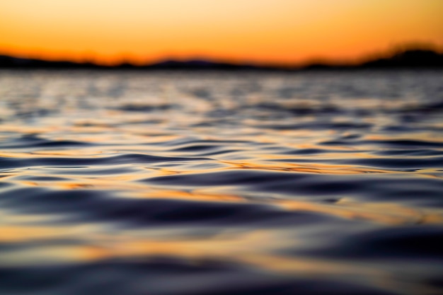 Free photo calm water during sunset