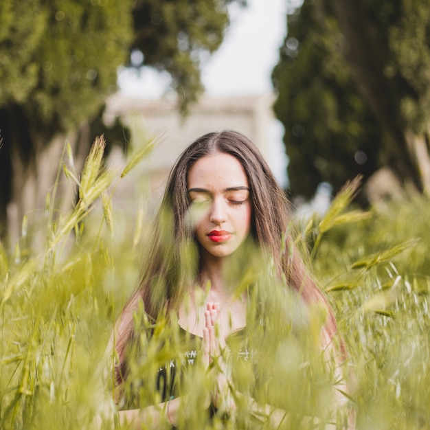 Calm woman in grass