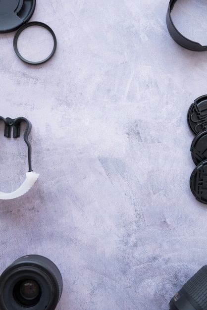 Free photo camera accessories arranged on concrete background