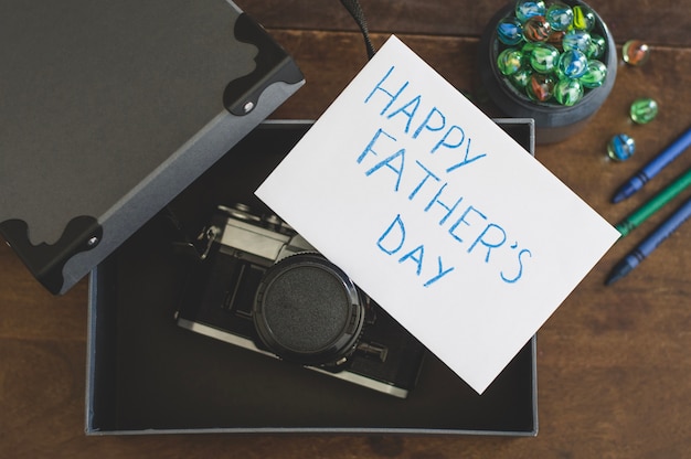 Free Photo camera in a box and father's day writing