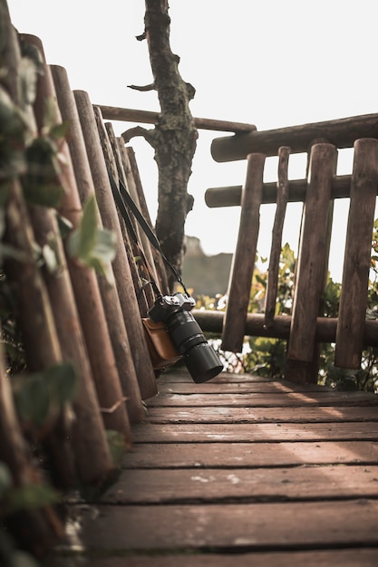 Free photo camera hanging on bench