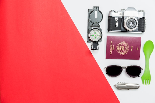 Free Photo camera and passport near travel supplies