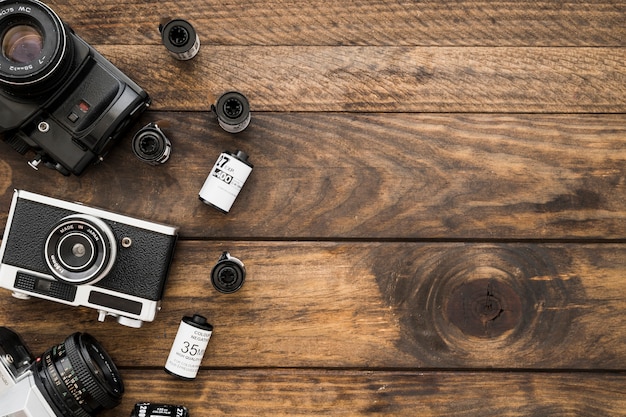 Cameras and film cassettes of timber tabletop