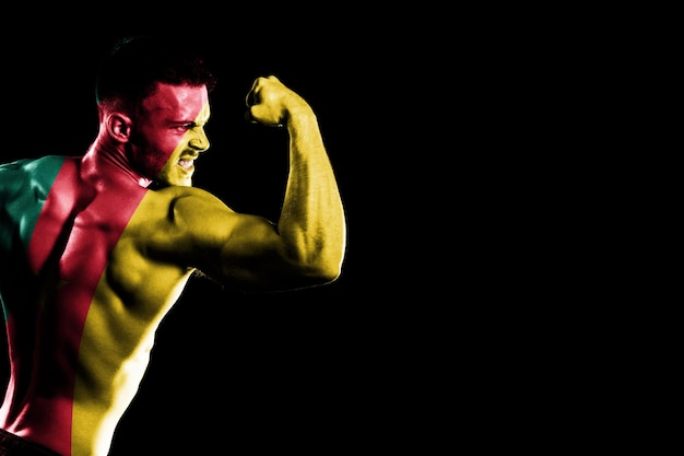 Free photo cameroon flag on handsome young muscular man black background