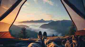 Free photo camper enjoys the mountain view from the comfort of a tent with hiking boots pointing toward the horizon