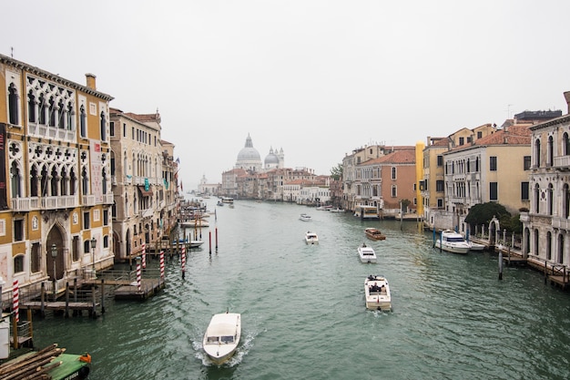 Canal with gondolas in Venice, Italy. Architecture and landmarks of Venice. Venice postcard with Venice gondolas.