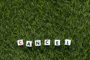 Free photo cancel message on grass with copy space