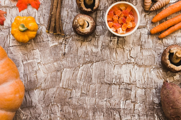 Free Photo candied fruit and twigs amidst vegetables