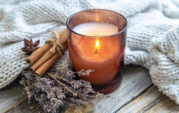 Candle cinnamon sticks and lavender closeup