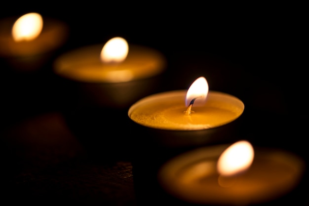 Free photo candles glowing in the dark