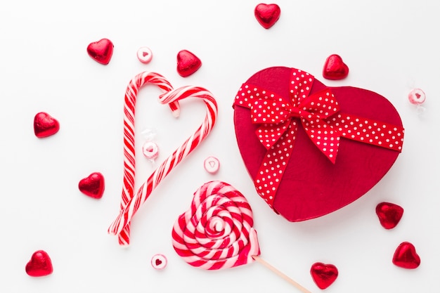 Candy cane lollipop and a heart shaped box