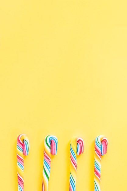 Candy canes on orange background