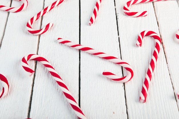 Free photo candy canes on wood desk