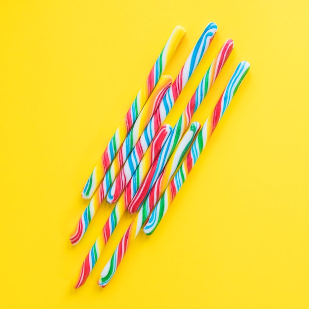 Candy canes on yellow backgound