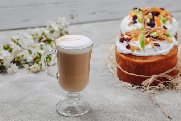 Free Photo cappuccino in a fancy glass with a cake