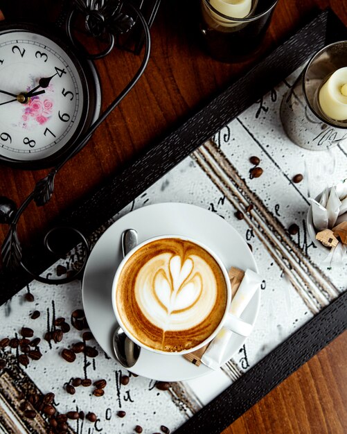 Cappuccino with flower picture top view