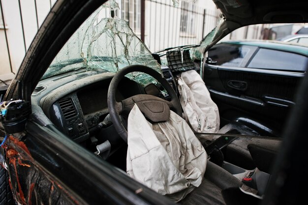 Car after accident Car interior with airbag after crash