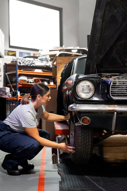 Car being taking care of in workshop