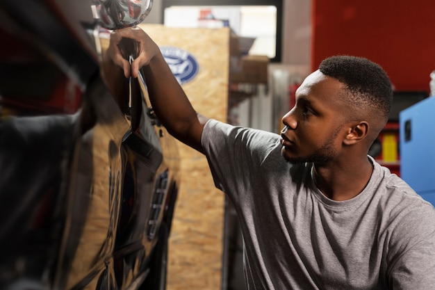 Car being taking care of in workshop