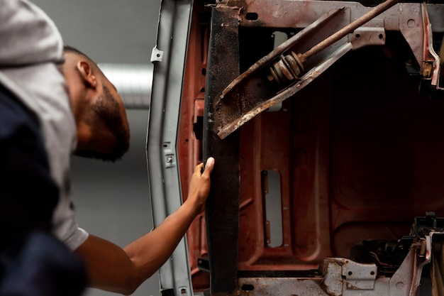 Car being taking care of in workshop