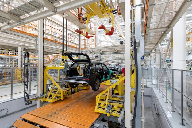 Free Photo car bodies are on assembly line factory for production of cars modern automotive industry a car being checked before being painted in a hightech enterprise