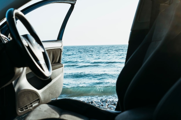 Car door open near sea