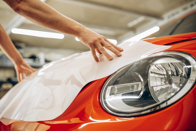 Free Photo car wrapping with foil at car service