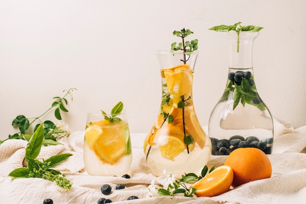 Free photo carafes with oranges and blueberries