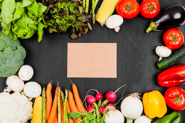 Cardboard with vegetables around