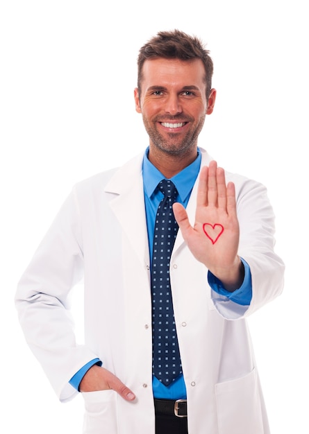 Free photo cardiologist showing heart sign