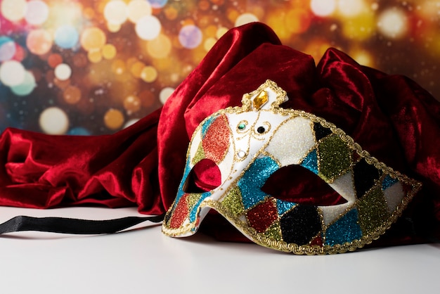 Carnival mask in front of blurred lights