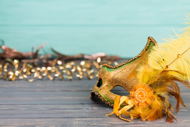 Carnival mask on wooden table