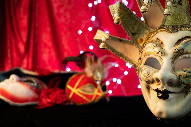 Carnival masks in front of blurred lights