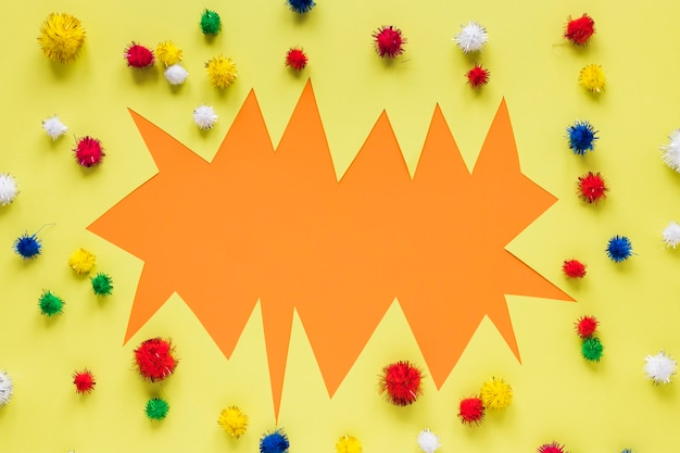 Free photo carnival paper cut-out with colorful pom-poms