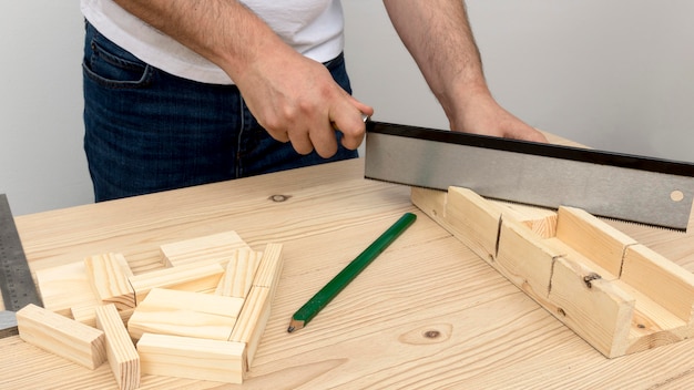 Carpenter making a design from wood